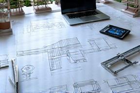 Custom gutter design blueprints on engineer's table